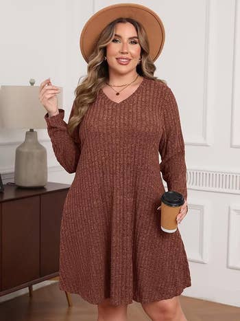 Model successful  cozy sweater formal  and wide-brimmed hat