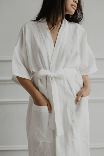 Image of model wearing white bathrobe