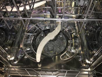 reviewer before image of a dirty dishwasher