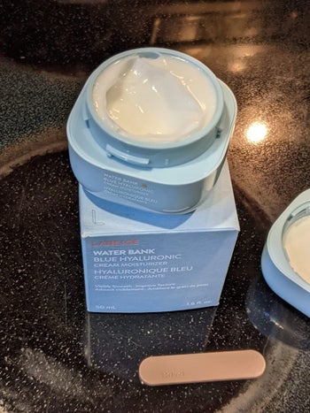 reviewer photo of the moisturizer and applicator