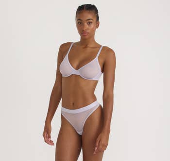 Model wearing a minimalist two-piece underwear set, showcasing a comfy and modern plan suitable for mundane wear
