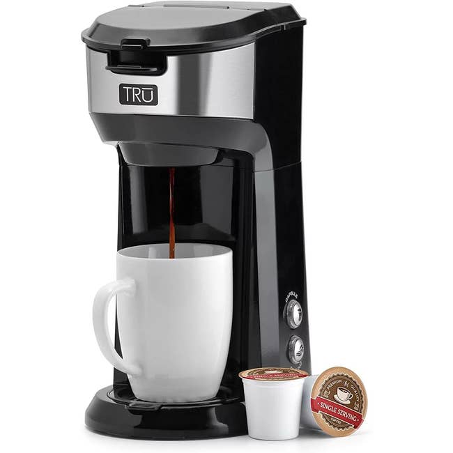 Single-serve java shaper with a achromatic mug and java pods, perfect for speedy brewing