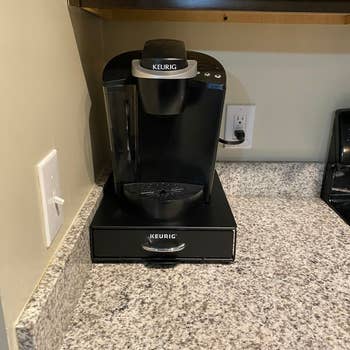 Keurig coffee maker on a kitchen counter, ready for use
