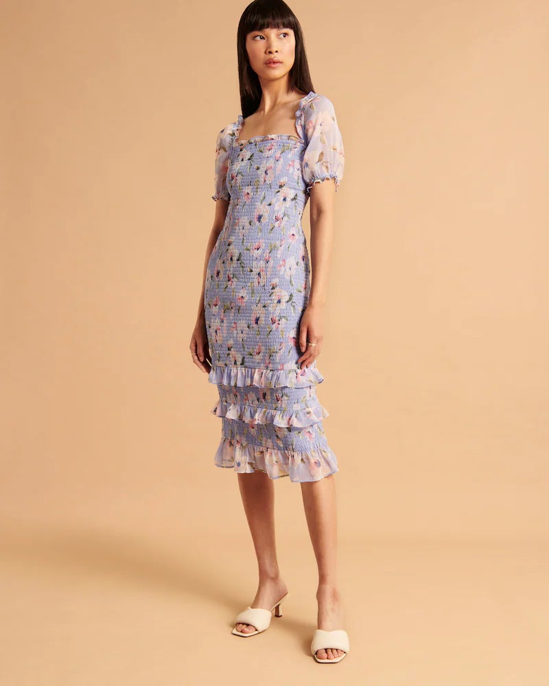 model wearing the light blue floral smocked midi dress
