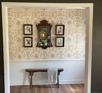 a reviewer's foyer with the yellow damask wallpaper