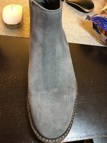 the same reviewer's boot now looking clean and new after using the suede cleaning brush