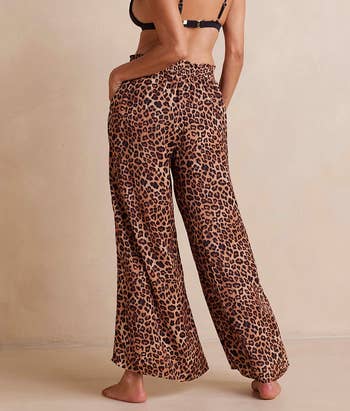 back of another model wearing the leopard print pants