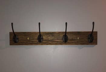 Reviewer image of the brown coat rack on wall