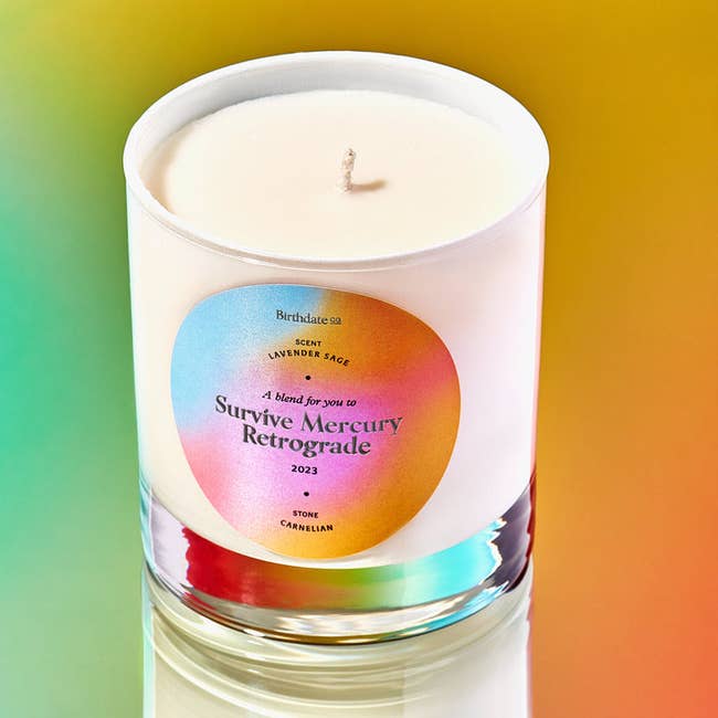 a close up of the glass candle and rainbow label