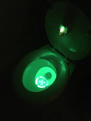 a reviewer's toilet with the green target lit up in the middle