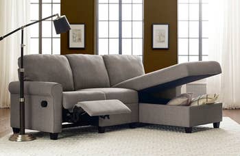 lifestyle photo of gray sectional couch with storage, reclining footrest