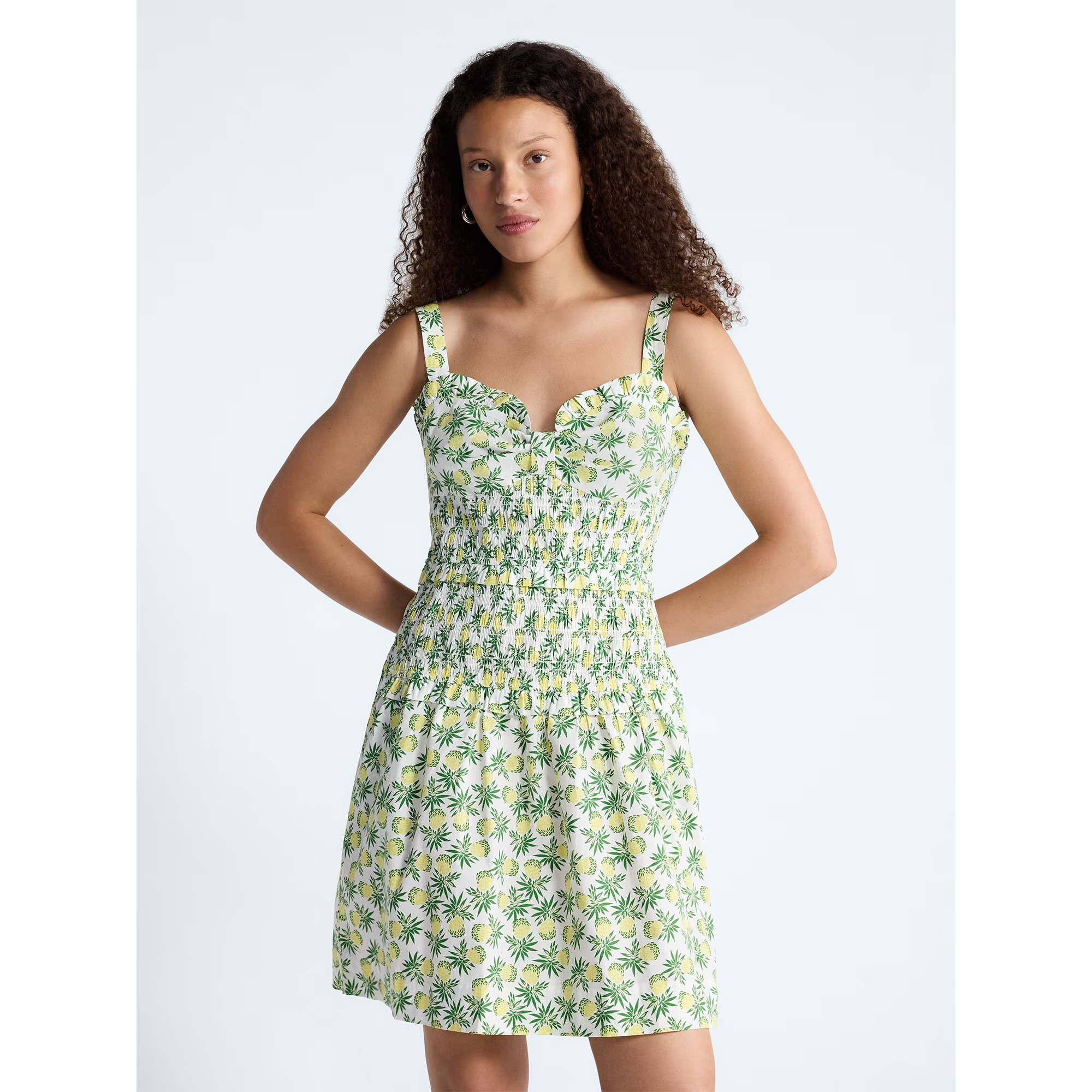 Person successful  a sleeveless, floral-print sundress with cinched waist, lasting  against a plain backdrop