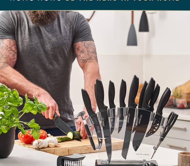 model cutting vegetables in the background with the knife set in the foreground on the clear stand showing all the tools