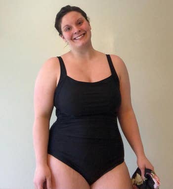 a reviewer wearing the swimsuit in black 