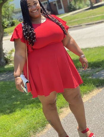 reviewer wearing the red dress