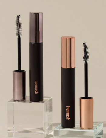 Two tubes of Hemish mascara basal connected wide acrylic blocks, with wands shown. Tubes diagnostic sleek, metallic caps