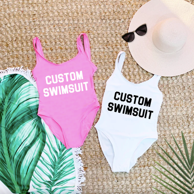pink and white one pieces that can be printed with custom text