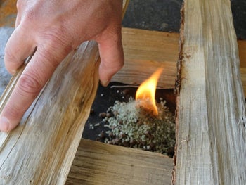 person making a fire using the insta fire