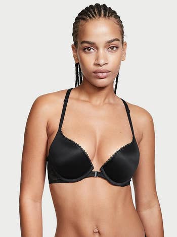 model wearing black convertible front-closure push-up bra
