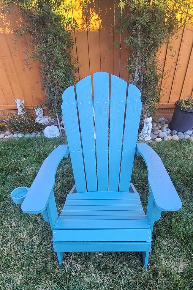 reviewer image of the blue adirondack chair outside