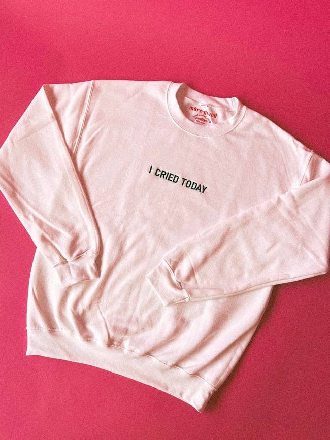 a pink sweatshirt with 