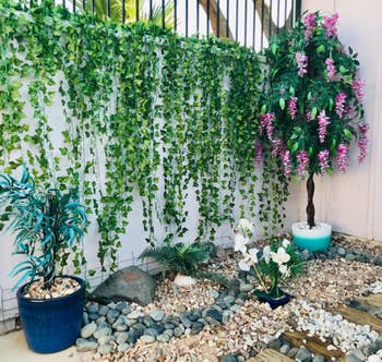 reviewer photo of the garland hung on a tall outdoor wall