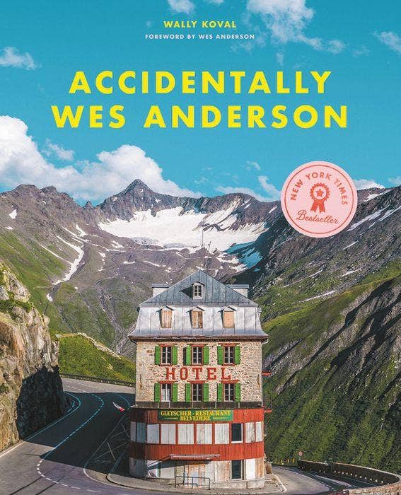 cover of the novel showcasing a colorful and symmetrical photo of a hotel in a mountain-scape