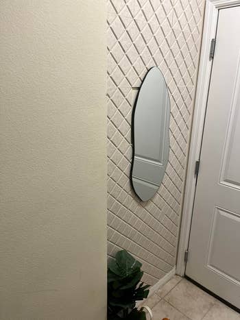 reviewer entryway wall with square tile like panels for noise dampening