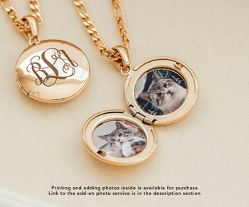 lifestyle image of locket with photos of cat inside
