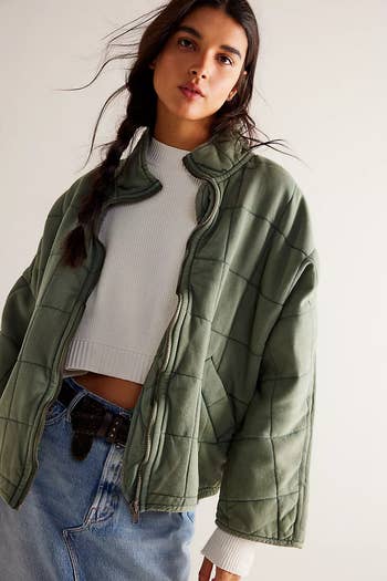model wearing the coat in green