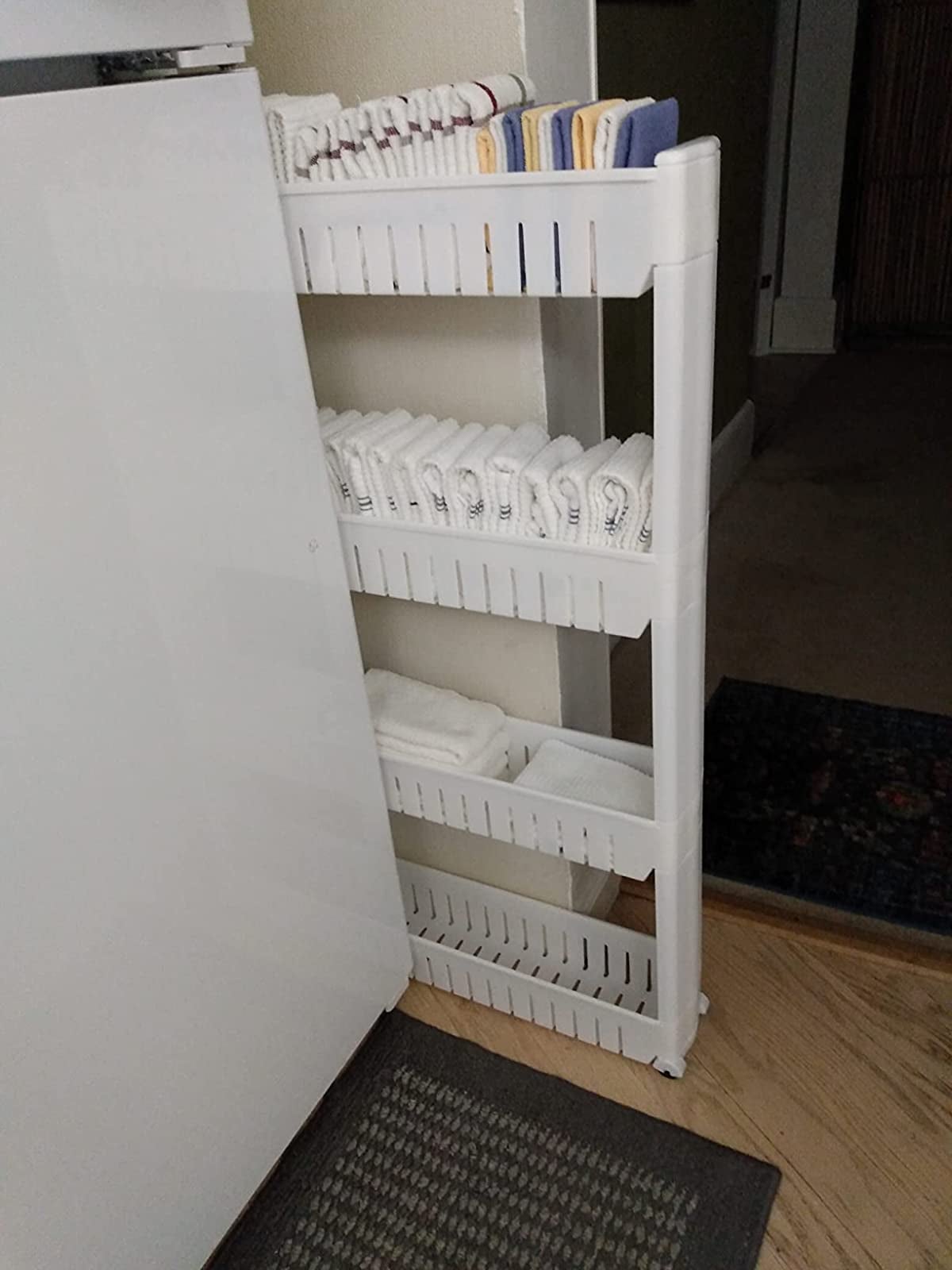 reviewer image of a slim white shelving unit
