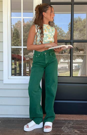 model wearing the green denim pants