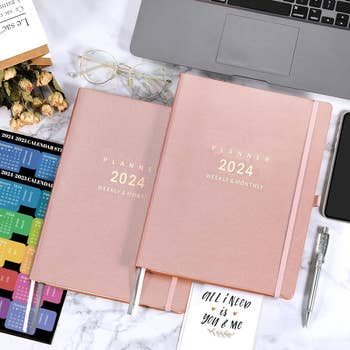 the 2024 planner in pink with gold text that says 