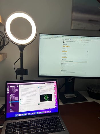 reviewer photo of a ring light on their desk being a laptop and computer monitor