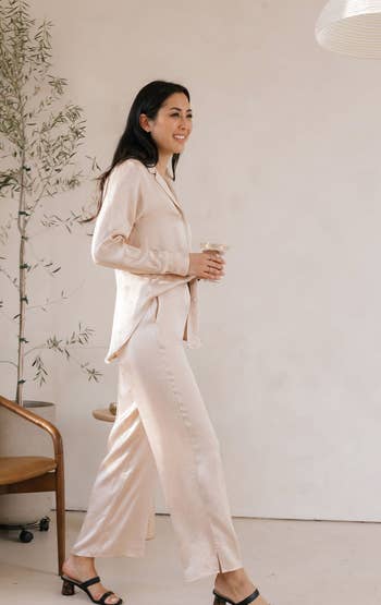 another model wearing the champagne-colored pants