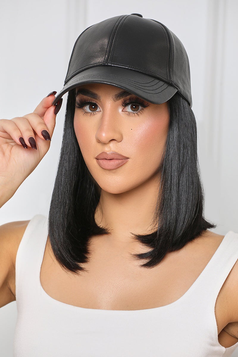 model wearing the faux leather baseball cap