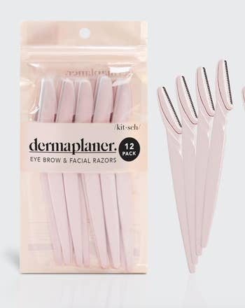 Pack of 12 pink dermaplaning eyebrow and facial razors in a clear plastic case