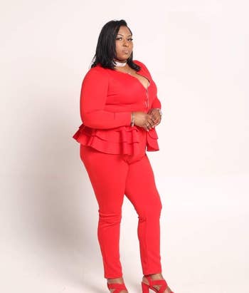reviewer wearing the red heels with a matching top and pants