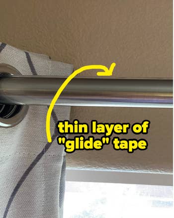 curtain rod with thin layer of glide tape installed on top 