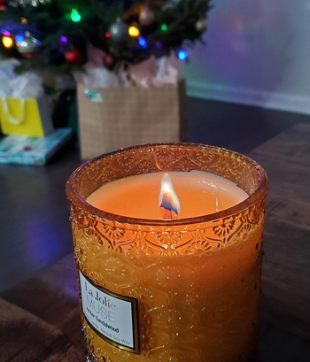 Reviewer image of detailed glass amber jar lit