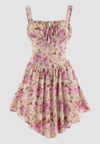 a pink floral print dress with a corset top and flared skirt bottom 