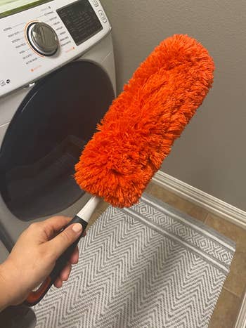 a red handheld duster