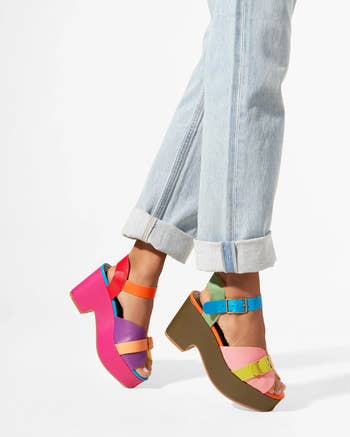 model wearing the multi-colored platform sandals