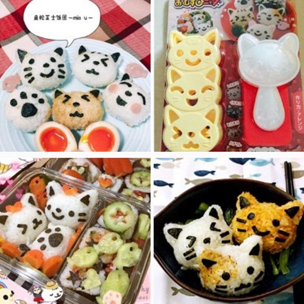 Rice balls in the shapes of cat heads with three different expressions on their faces 