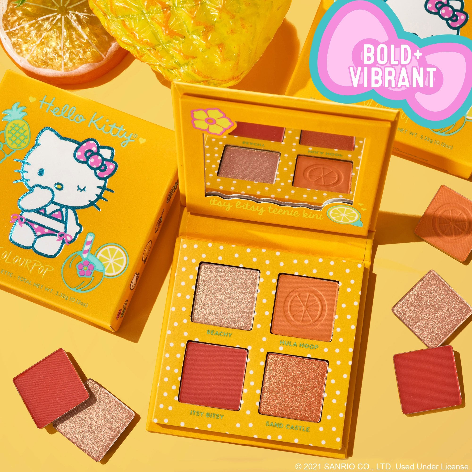 an orange palette with hello kitty in a bikini on it and four shades of eyeshadow
