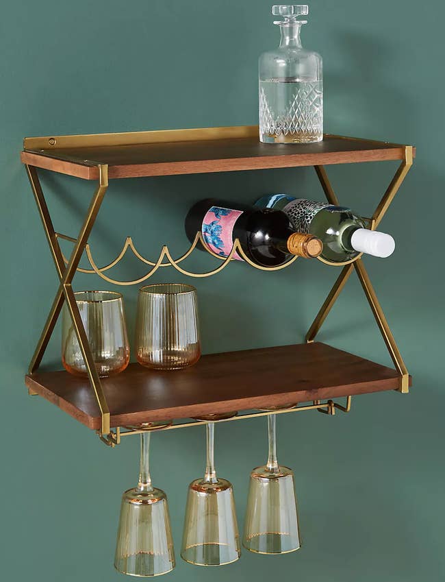 Image of the brown and gold hanging wine rack with bottles and glasses