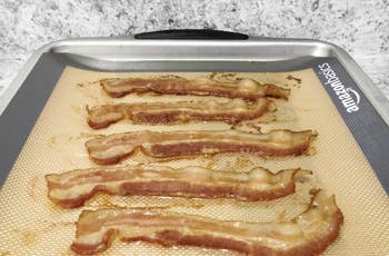 A reviewer's cooked bacon on a sheeet pan 