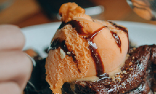 a tangerine flavored ice cream with chocolate swirls on it