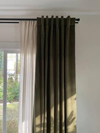 A dark green velvet curtain