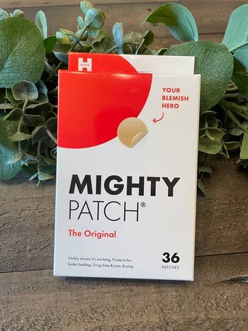 Box of Mighty Patch acne patches successful  beforehand   of greenery; labeled arsenic  